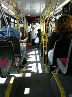 Passengers sitting inside a public transit bus