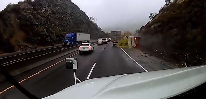 Out-of-Control Truck Overturns After Brakes Fail on Wet Mountain Road